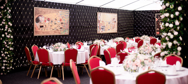 A marquee with fairy lights and tables