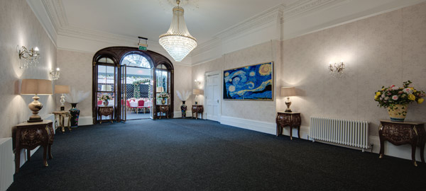 A ballroom with a chandelier 